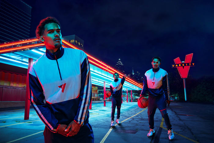Multiple Trae Young's posing in Adidas clothing.
